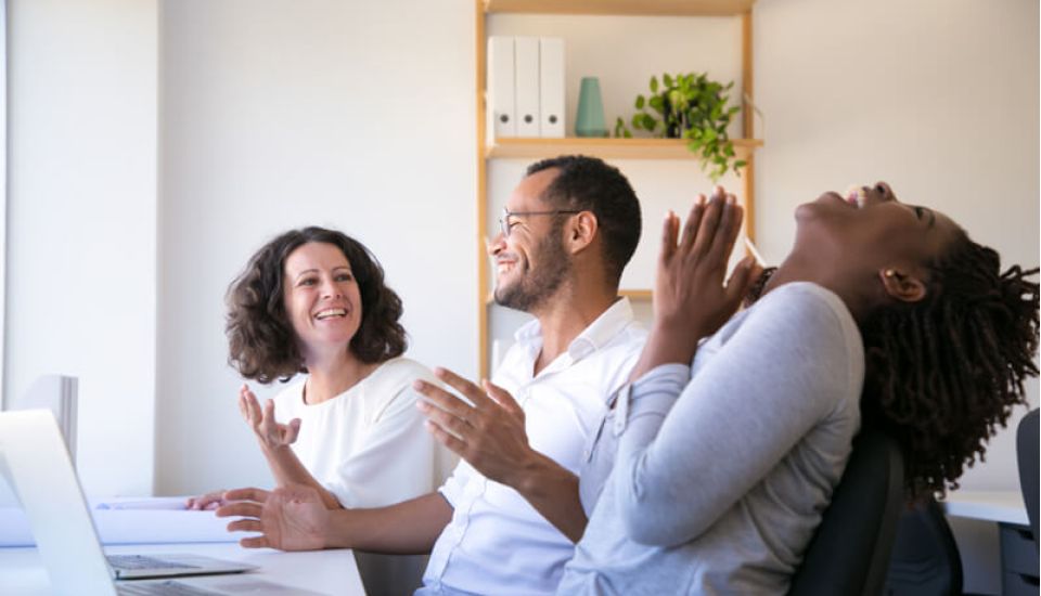 A motivated team of workers smiling