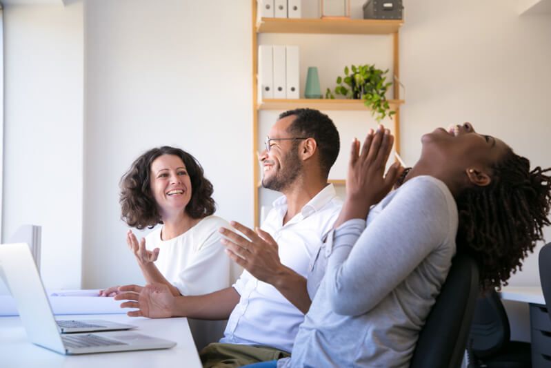 A motivated team of workers smiling