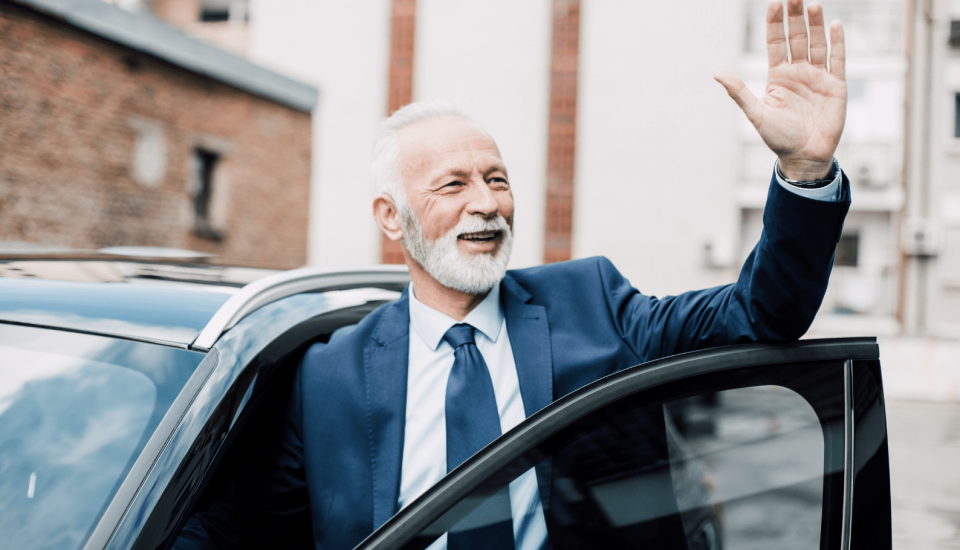 Business person waving