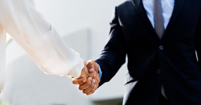 two businessmen shaking hands