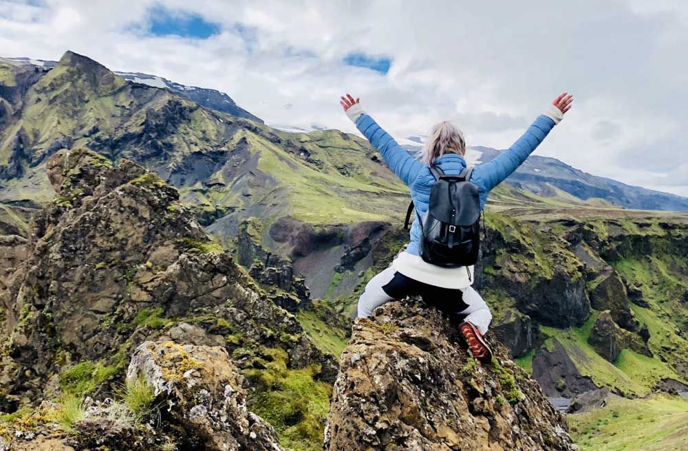 person climbing a mountain